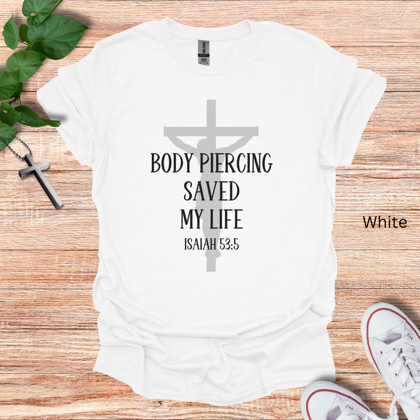 Christian t-shirt gift for tattoo artists and body piercers. The design is a crucifix and the words "Body Piercing Saved My Life"