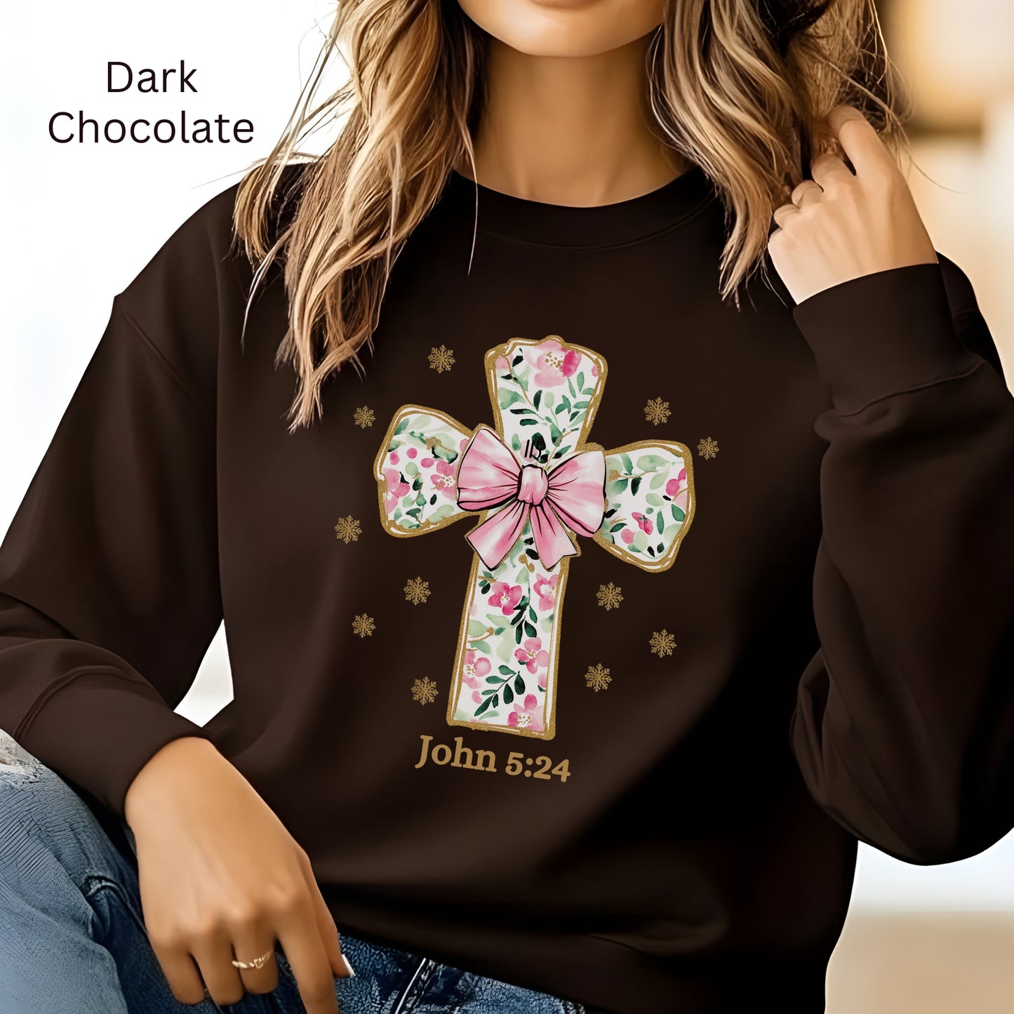 A cozy black sweatshirt with a beautiful large flowered cross on the front trimmed in gold. John 324 is noted below.