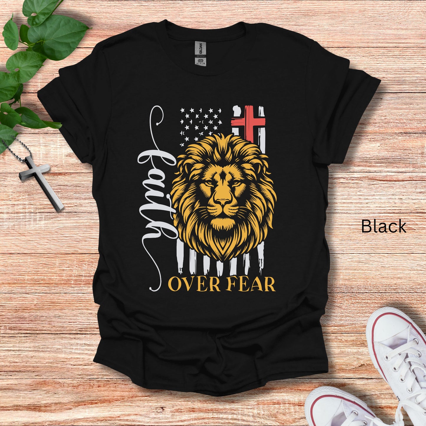 Faith Over Fear tshirt shown in black with a gold Lion of Judah on front. 