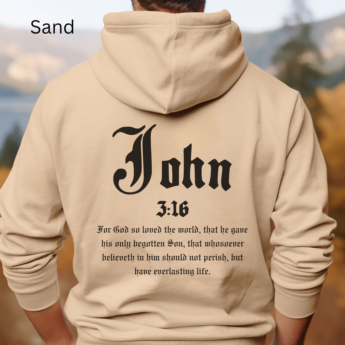 This Jesus hoodie is shown in sand color and has John 3:16 in large letters on the back with the bible scripture written out. The front has a cross made of nails on the left breast.