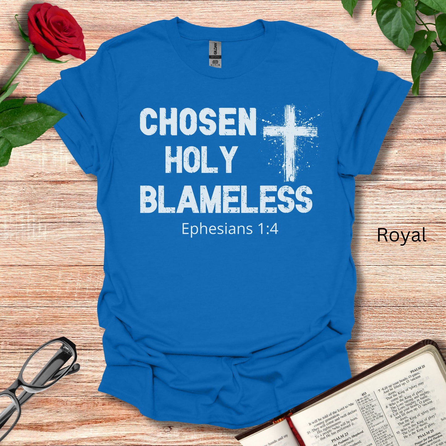 Chosen Holy Blameless is the profound message on this royal blue Christian :Jesus Lover t-shirt. It notes Ephesians 1:4 under the typography and the religious Cross graphic.