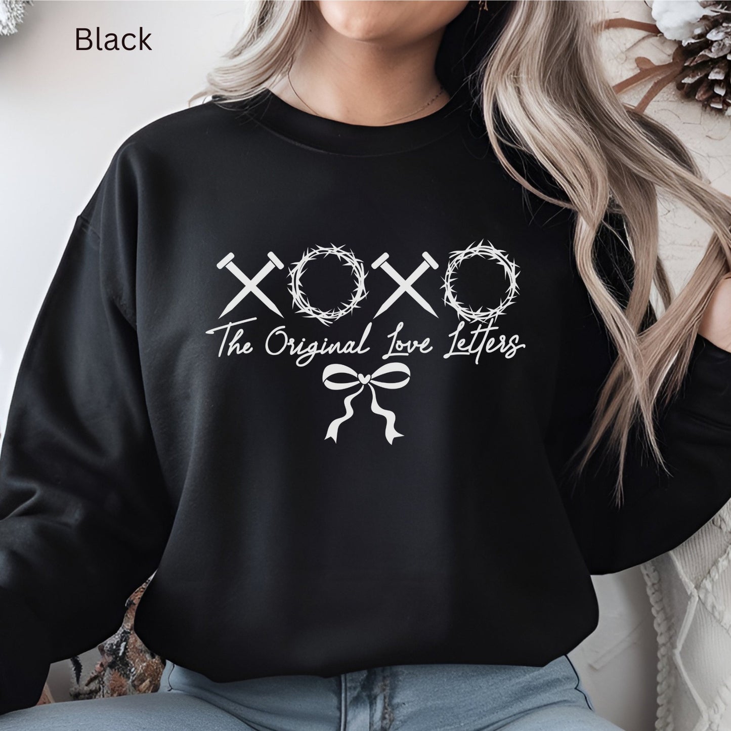 a Christian Valentine Sweatshirt with XOXO made of nails and crowns of thorns and "The Original Love Letters" underneath.