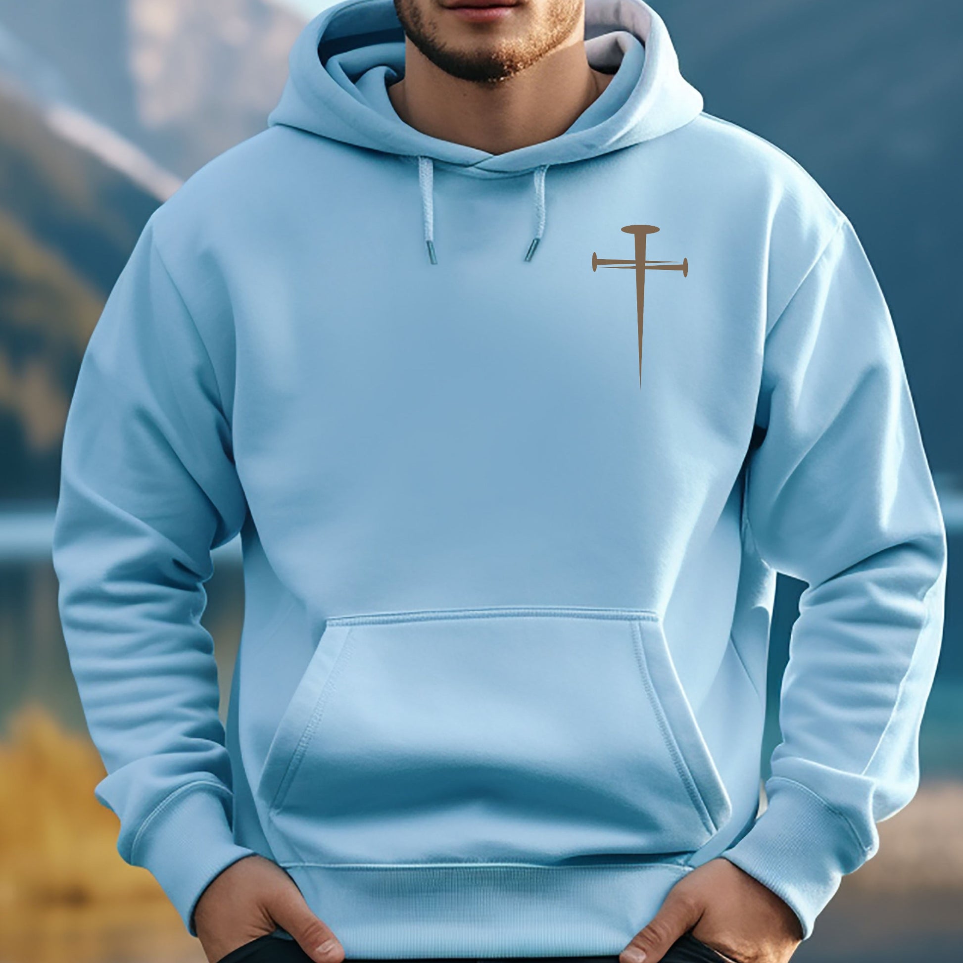 Jesus hoodie with Lion of Judah graphic on back with Rev 5:5 and a cross made of spikes on front. Shown in light blue. 