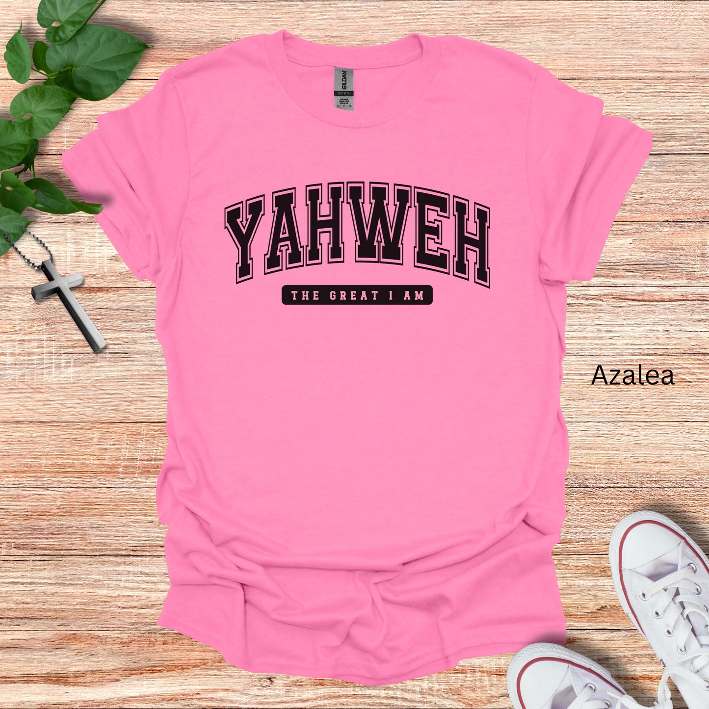 YAHWEH in college font on a pink tshirt shown  with "The Great I Am" on the front. 