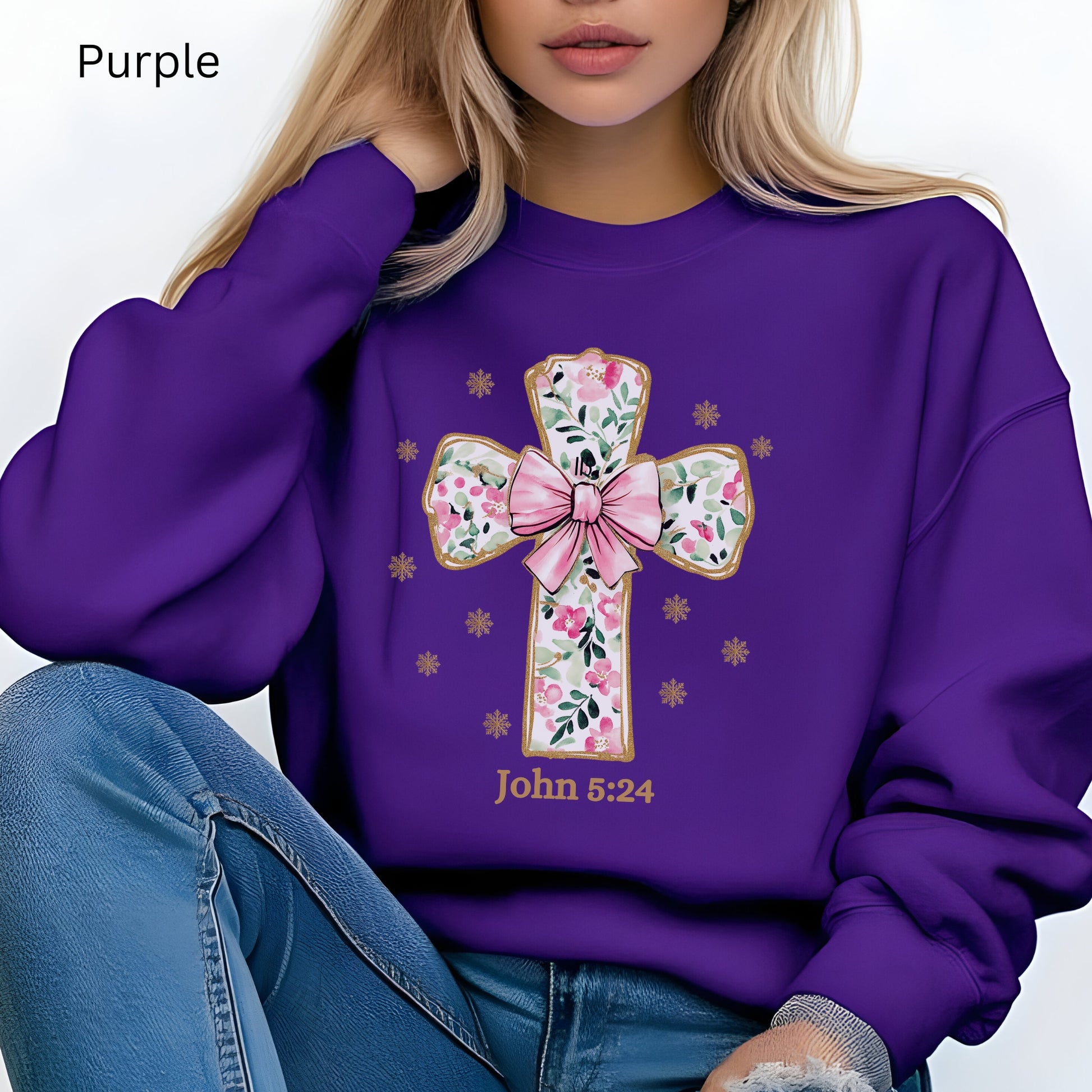 This coquette Christian cross sweatshirt is super stylish with John 5:24 listed under the beautiful gold and pink cross. 